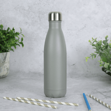 Load image into Gallery viewer, grey stainless steel bottle on concrete style surface with drinking straws in the foreground
