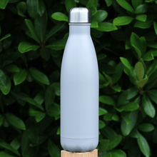 Load image into Gallery viewer, grey stainless steel vaccum bottle on fence post outdoors with foliage in the background
