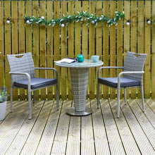 Load image into Gallery viewer, grey rattan cone bistro set on patio space with coffee mug and magazine resting on glass table top
