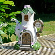Load image into Gallery viewer, Solar fairy home coffee pot in the sunshine on decking with plants in the garden
