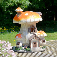 Load image into Gallery viewer, Solar mushroom house sitting on decking in the summer sunshine
