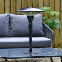 Load image into Gallery viewer, Electric patio heater, black steel with pull cord on/off switch on a glass topped coffee tale for outdoor entertaining
