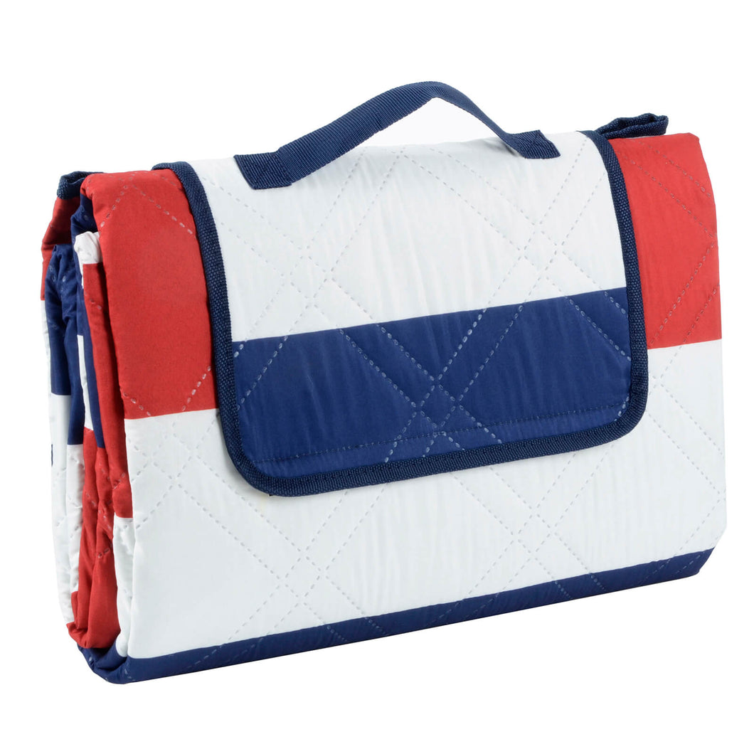 red white and blue picnic blanket folded into compact carry bag with handle