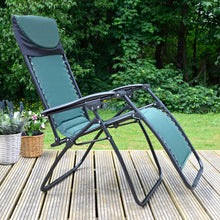 Load image into Gallery viewer, Green and black padded garden lounger chair with plants on decking
