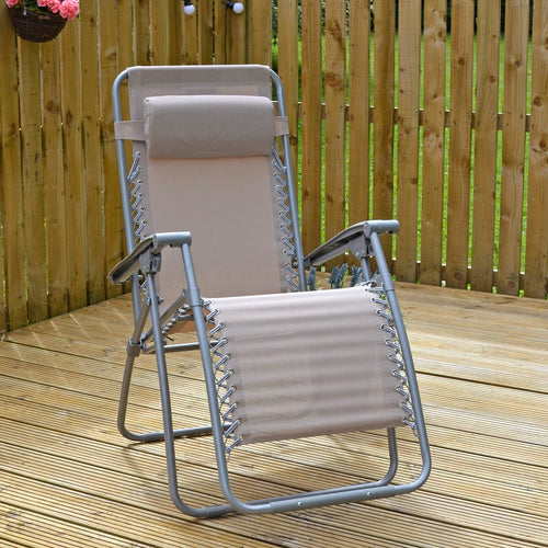 Beige taupe garden recliner chair with head cushion and silver grey frame, sitting on decking with hanging basket and party lights